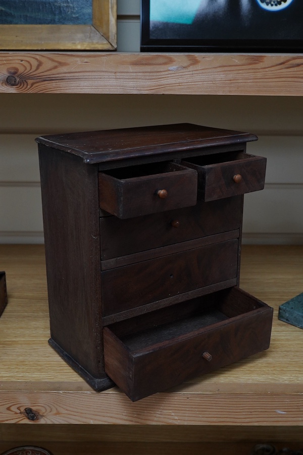 A Victorian miniature mahogany chest of drawers, 27cm high. Condition - poor